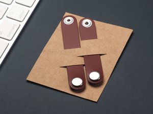 Nappikuulokkeiden organisaattori 2317094